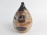 a vase with a painting on it on a white surface