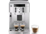 a close up of a coffee machine with two cups of coffee