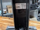 an image of a close up of a remote control on a wooden table
