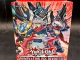 a box of card game cards with a picture of a demonic demon