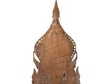 an image of a wooden sculpture of a crown on a stand