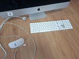 a computer monitor, keyboard, mouse and mouse on a desk