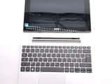 a laptop computer sitting on top of a white table