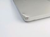 a laptop computer sitting on top of a white desk