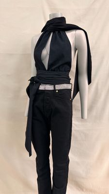an image of a mannequin wearing a black top and jeans