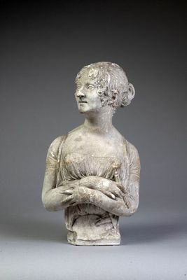 statue of a woman holding a bird in her hands