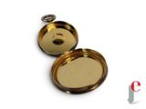 a small gold pocket watch with a chain around it
