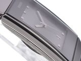 a close up of a wrist watch on a glass table