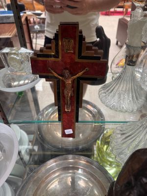 a cross on a glass table in a store