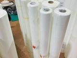 several rolls of white paper are stacked on top of each other