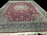 an image of a large oriental rug on a black background