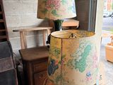 a lamp that is sitting on a table in front of a window