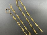 three pairs of gold plated earrings and a chain