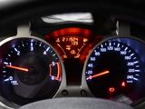 a close up of a car dashboard with a speedometer and gauges