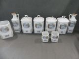 seven different types of ceramic containers and cups on the table