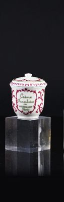 two small vases sitting on top of a table next to each other