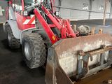 a tractor that is parked inside of a building
