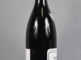 a bottle of wine that is sitting on a table
