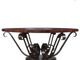 a wooden table with metal legs and a circular table top