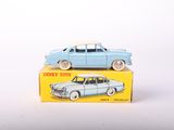 a small toy car sitting on top of a box