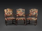 a set of four carved and upholstered armchairs