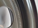 a close up of a metal rim with a hole in it