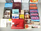 several books are stacked on top of each other on a table