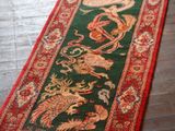 a close up of a rug on a wooden floor with a wooden floor