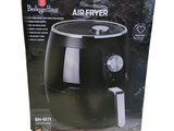 an air fryer in the box on the table