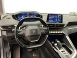 the interior of a car with a steering wheel and dashboard controls