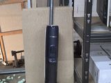 a vacuum that is sitting on the floor next to a box