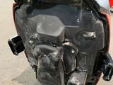 a close up of a motorcycle that is parked on the street