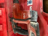 a drill in the back of a red box