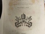 an old book with a picture of two guns on top of it