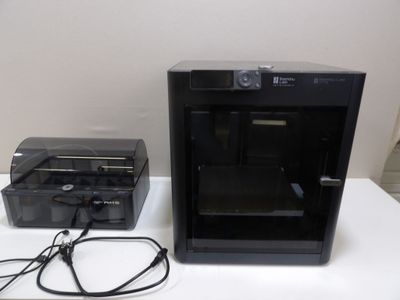 a picture of a printer and a printer case on a table