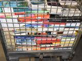 a cart full of books sitting on the floor