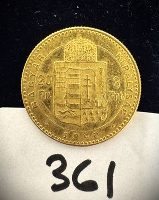 un gros plan d'une pièce d'or posée sur un morceau de papier