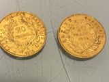 two gold coins, one of which is a sovereign and the other of which is a sovereign