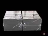 two boxes of cigarettes sitting on top of each other