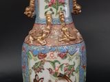 a vase that is sitting on a black surface