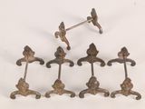 four antique cast iron door handles with a bird on them