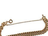 the gold chain bracelet is attached to a chain with a clasp