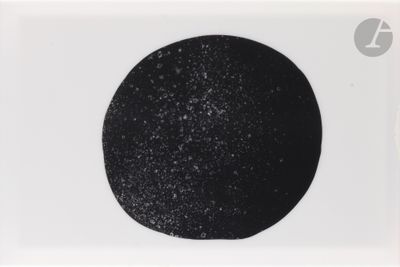black and white photograph of a black dot on a white background