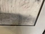 a picture of a painting on the wall of a bathroom