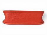 a close up of a red leather case on a white background