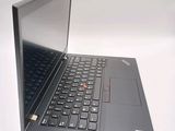a laptop computer that is open on a white surface