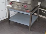 a stainless steel stove with two burners on top of it