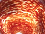an image of a red and white bowl with chains hanging from it