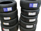 several tires stacked on top of each other on a white surface