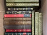 a box full of books that are sitting on a table